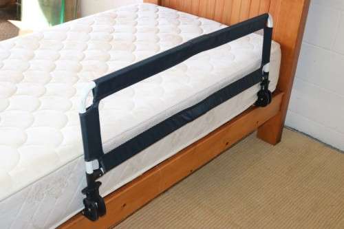 A practical and useful "Chelino Sleep Safe" toddler bed guard in good condition