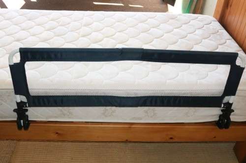 A practical and useful "Chelino Sleep Safe" toddler bed guard in good condition