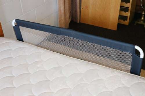 A practical and useful "Chelino Sleep Safe" toddler bed guard in good condition