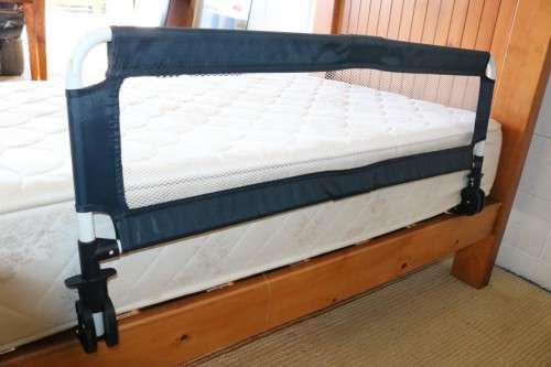 A practical and useful "Chelino Sleep Safe" toddler bed guard in good condition