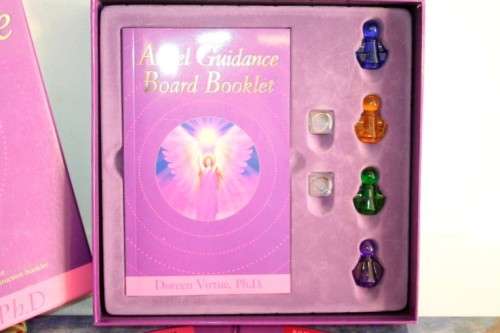 A boxed "Angel Guidance Board" by Doreen Virtue including folding board,crystal dice and booklet
