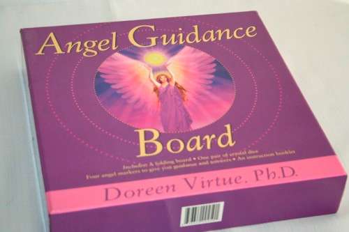 A boxed "Angel Guidance Board" by Doreen Virtue including folding board,crystal dice and booklet