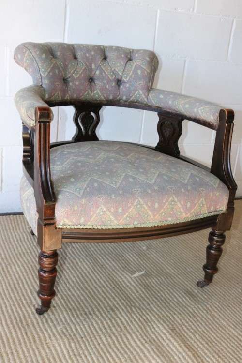 A superb antique Edwardian upholstered library armchair on its original castors - amazing!