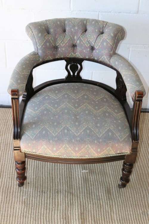 A superb antique Edwardian upholstered library armchair on its original castors - amazing!