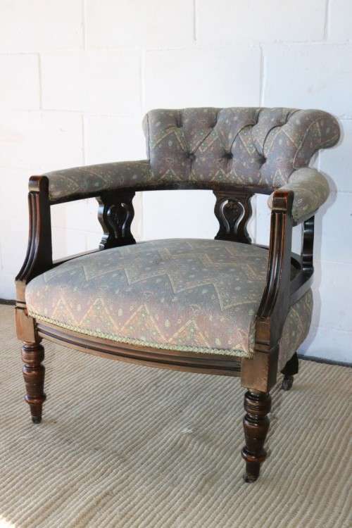 A superb antique Edwardian upholstered library armchair on its original castors - amazing!