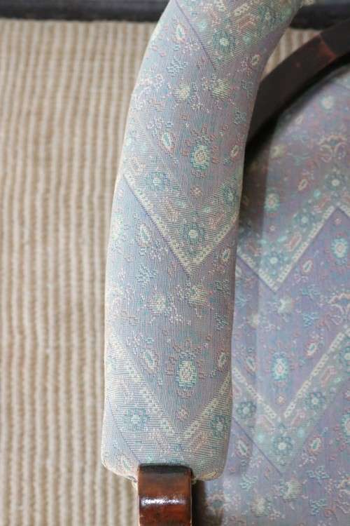 A superb antique Edwardian upholstered library armchair on its original castors - amazing!