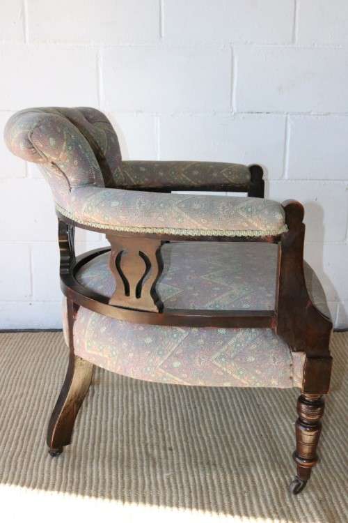 A superb antique Edwardian upholstered library armchair on its original castors - amazing!