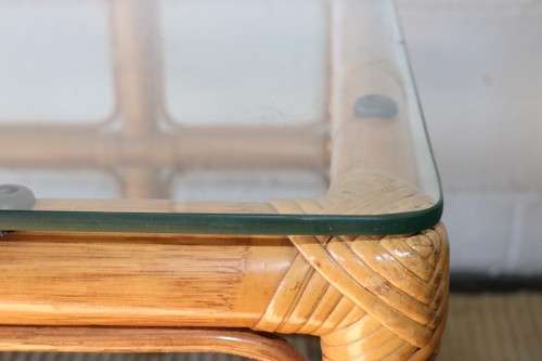 A lovely cane occasional/ coffee table with a removable glass top - stunning in a holiday home