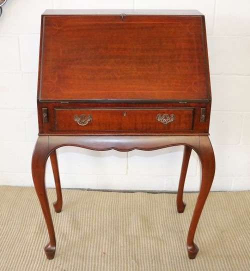 A remarkable vintage Mahogany "Regency" Queen Anne fall-top writing bureau with a large drawer