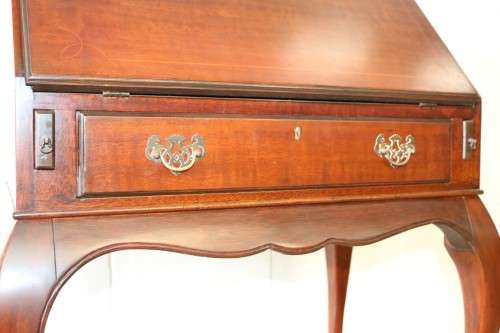 A remarkable vintage Mahogany "Regency" Queen Anne fall-top writing bureau with a large drawer