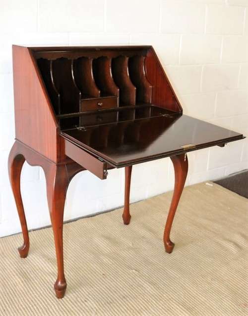 A remarkable vintage Mahogany "Regency" Queen Anne fall-top writing bureau with a large drawer