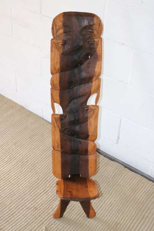 An amazing Blackwood African "birthing" chair with stunning hand carved detailing - practical!