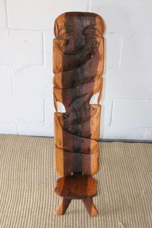 An amazing Blackwood African "birthing" chair with stunning hand carved detailing - practical!