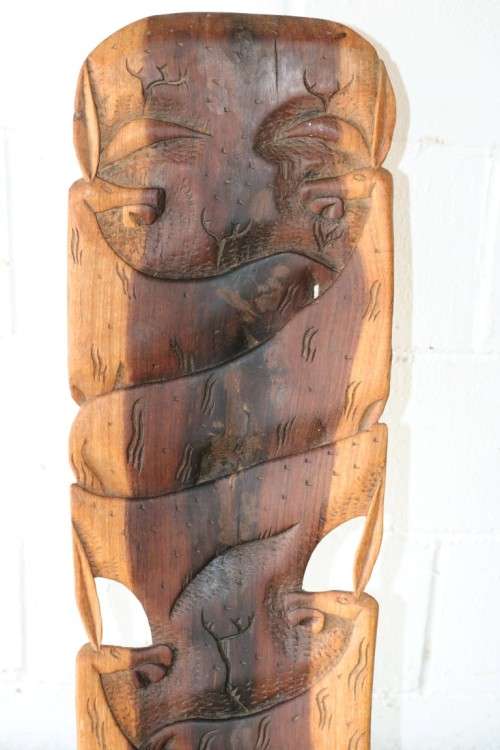 An amazing Blackwood African "birthing" chair with stunning hand carved detailing - practical!