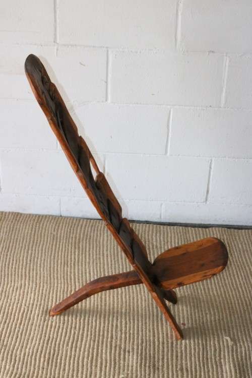 An amazing Blackwood African "birthing" chair with stunning hand carved detailing - practical!