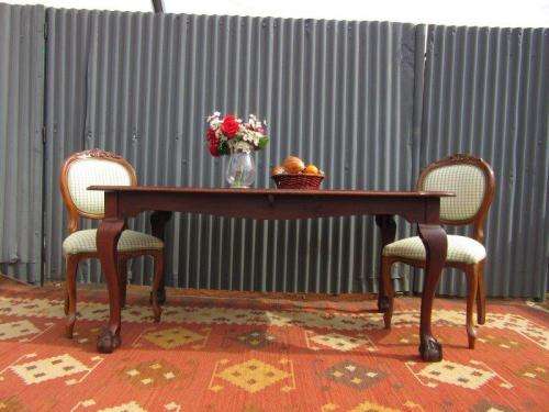 An amazing vintage Imbuia dining table with oversized ball and claw feet in wonderful condition