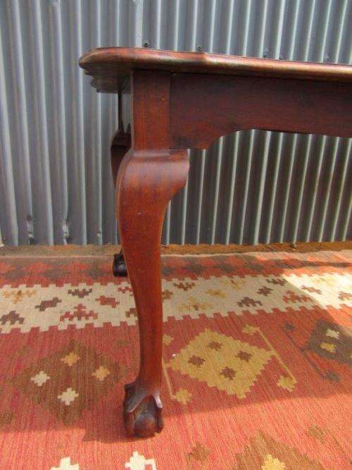 An amazing vintage Imbuia dining table with oversized ball and claw feet in wonderful condition