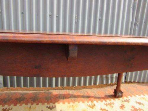 An amazing vintage Imbuia dining table with oversized ball and claw feet in wonderful condition