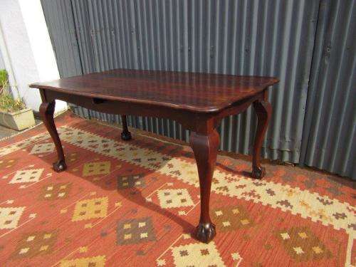 An amazing vintage Imbuia dining table with oversized ball and claw feet in wonderful condition