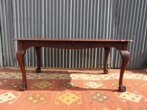An amazing vintage Imbuia dining table with oversized ball and claw feet in wonderful condition