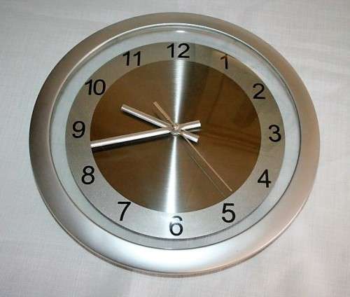 A stunning modern styled quartz clock in a brushed steel & polished steel combination look - RS17CL