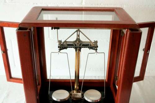 An exceptionally rare antique "Apothecary" scale in its original glass and Mahogany wood case