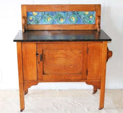 A wonderful vintage solid Oak wash stand with a black marble top and tiled splash back - stunning!