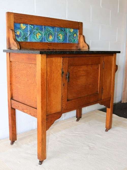 A wonderful vintage solid Oak wash stand with a black marble top and tiled splash back - stunning!