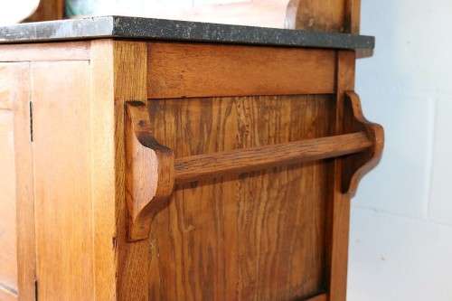 A wonderful vintage solid Oak wash stand with a black marble top and tiled splash back - stunning!