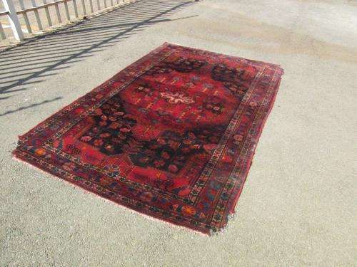 A wonderful vintage Persian Carpet (2.3m x 1.4m) in deep red, black and rust colours - stunning!