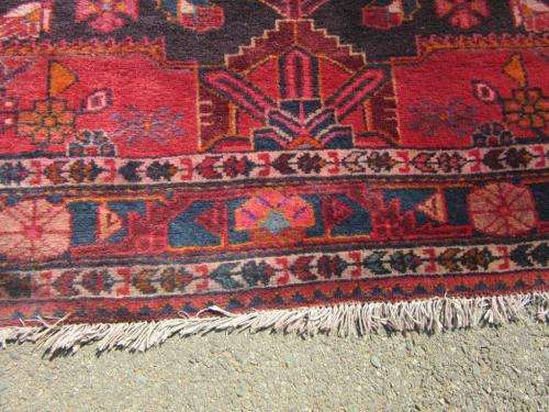 A wonderful vintage Persian Carpet (2.3m x 1.4m) in deep red, black and rust colours - stunning!