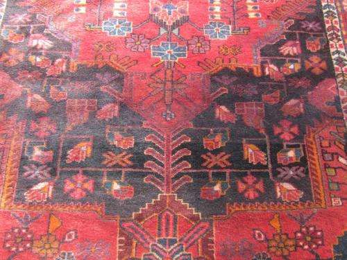 A wonderful vintage Persian Carpet (2.3m x 1.4m) in deep red, black and rust colours - stunning!