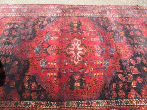 A wonderful vintage Persian Carpet (2.3m x 1.4m) in deep red, black and rust colours - stunning!