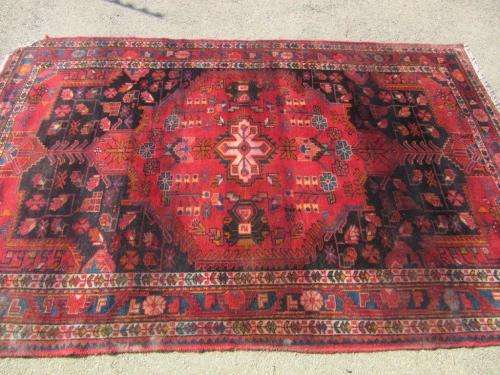 A wonderful vintage Persian Carpet (2.3m x 1.4m) in deep red, black and rust colours - stunning!