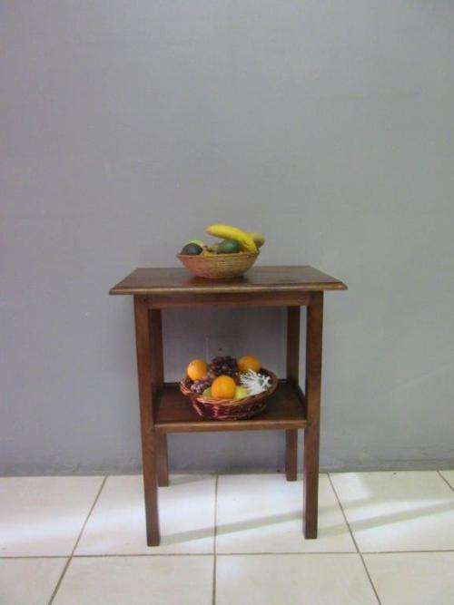 A wonderful vintage solid Teak occasional table with two levels in great condition