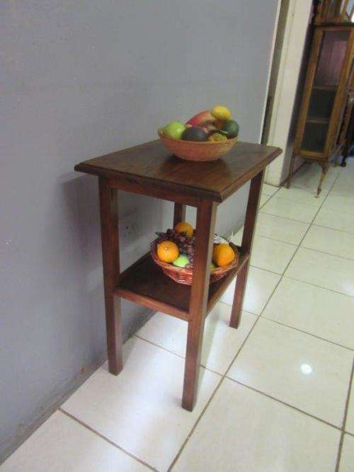 A wonderful vintage solid Teak occasional table with two levels in great condition