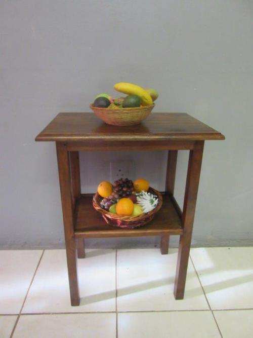A wonderful vintage solid Teak occasional table with two levels in great condition