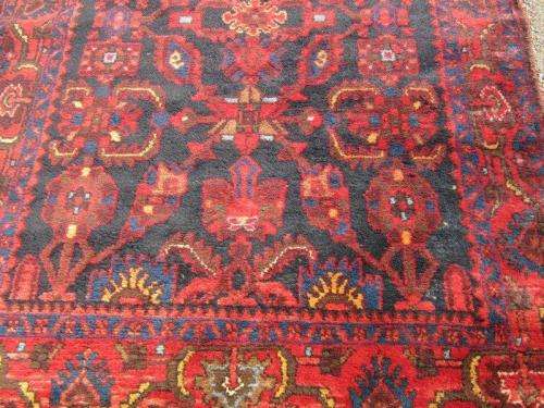 An amazing vintage Persian Carpet (1.9m x 1.4m) in deep red, blue and black detailing - wow!