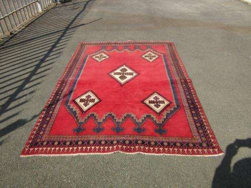 A magnificent vintage Iranian "Sirjani" Bokhtiari Kilim Persian carpet in vibrant red, blues, cream
