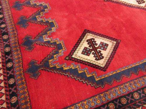 A magnificent vintage Iranian "Sirjani" Bokhtiari Kilim Persian carpet in vibrant red, blues, cream
