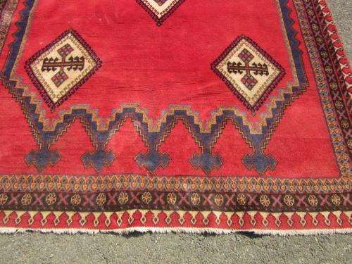 A magnificent vintage Iranian "Sirjani" Bokhtiari Kilim Persian carpet in vibrant red, blues, cream