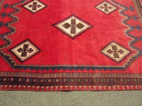 A magnificent vintage Iranian "Sirjani" Bokhtiari Kilim Persian carpet in vibrant red, blues, cream
