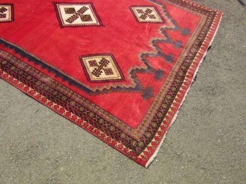 A magnificent vintage Iranian "Sirjani" Bokhtiari Kilim Persian carpet in vibrant red, blues, cream