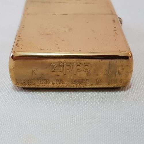 A collectable c1993 Zippo Barrett Smythe limited edition "Dinosaurs" T-Rex brass-finished lighter