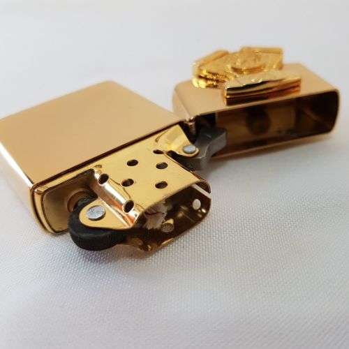 A mega-rare 1995 gold plated Zippo limited edition Harley Davidson "Sculpture V2 Engine" lighter