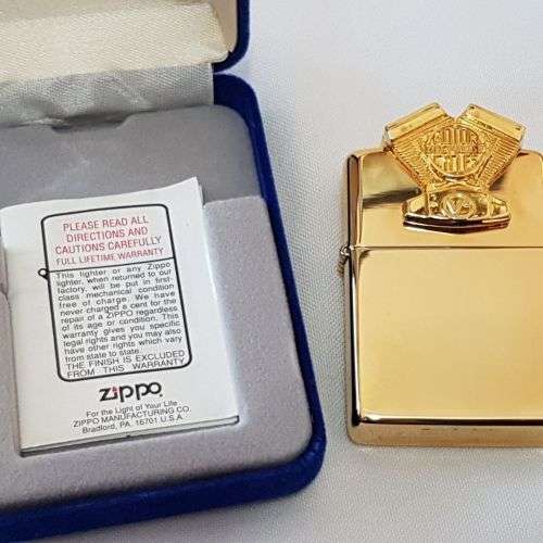 A mega-rare 1995 gold plated Zippo limited edition Harley Davidson "Sculpture V2 Engine" lighter