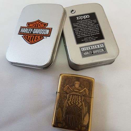 An incredible RARE unused brass Barrett Smythe "Harley Davidson" Tire (tyre) logo Zippo lighter