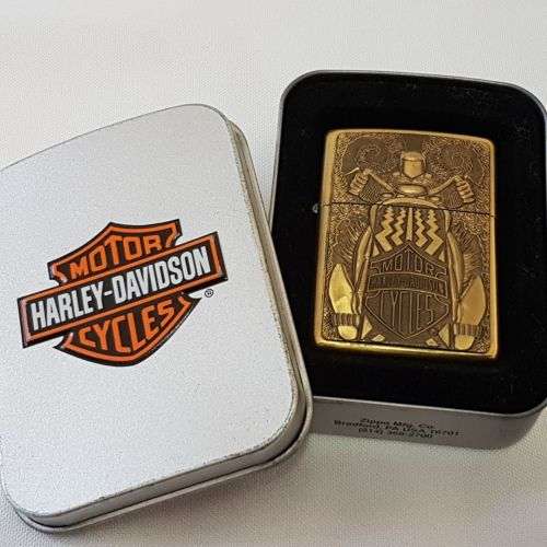 An incredible RARE unused brass Barrett Smythe "Harley Davidson" Tire (tyre) logo Zippo lighter