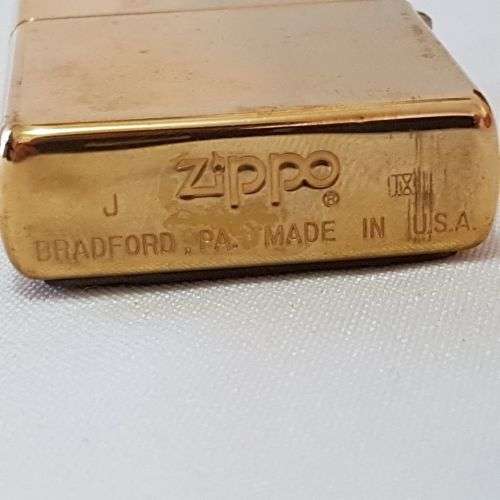 An awesome c1993 Zippo Barrett Smythe limited edition "Dinosaurs" Triceratops brass-finished lighter