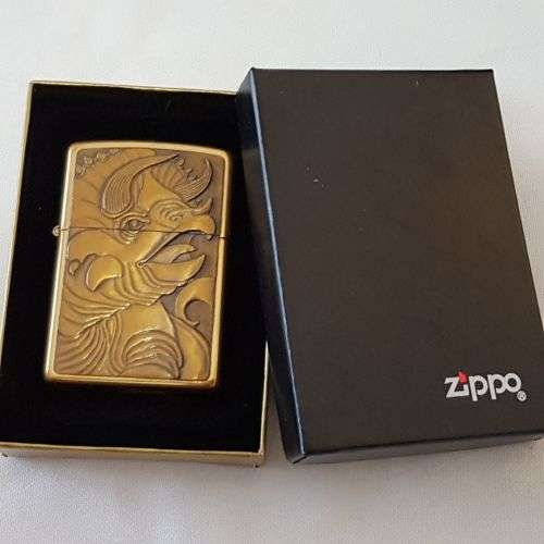 An awesome c1993 Zippo Barrett Smythe limited edition "Dinosaurs" Triceratops brass-finished lighter
